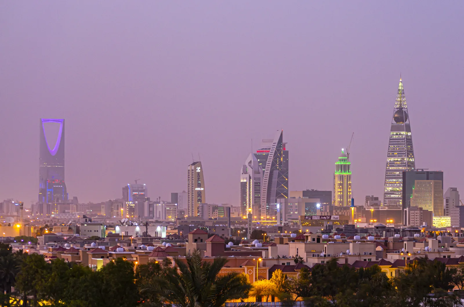 Riyadh city skyline at dusk with illuminated towers