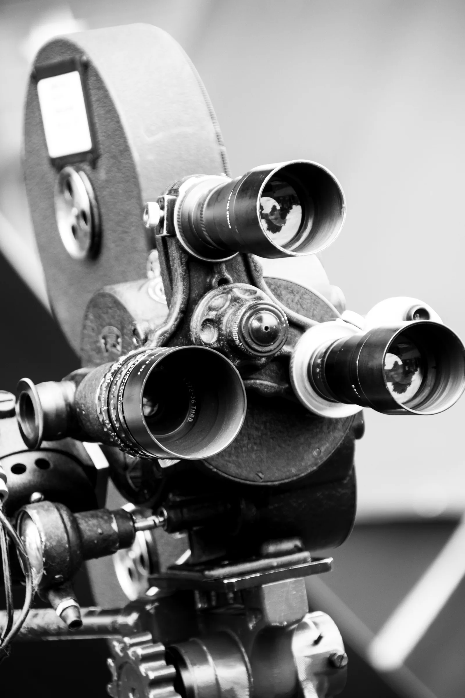 Close-up black and white photograph of a vintage film camera
